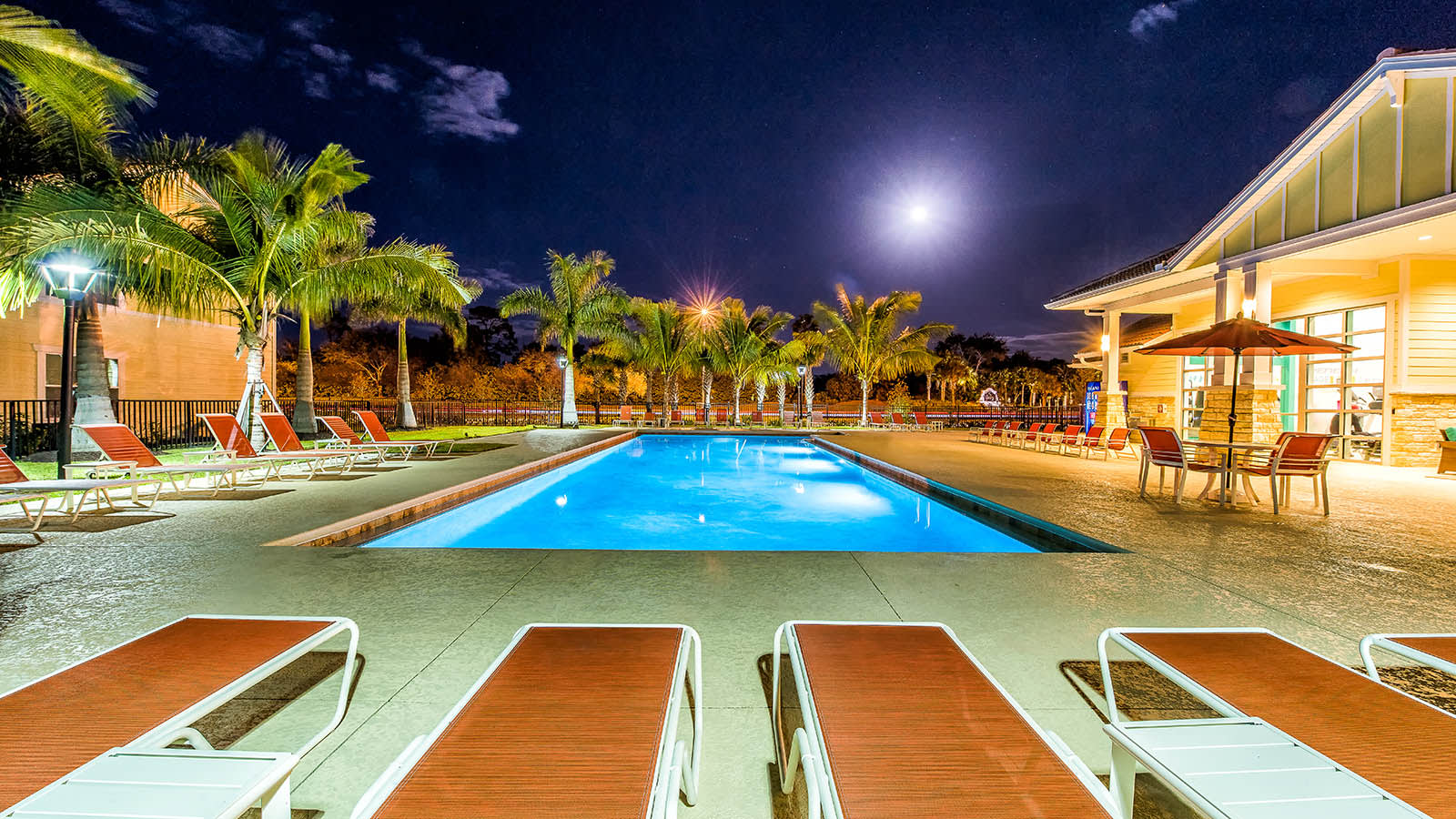 Swimming Pool At Night at DELETED - Longitude 81 in Estero, FL