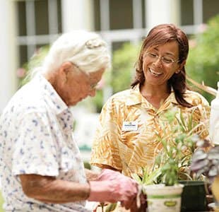 senior living resident and dog in Aiken