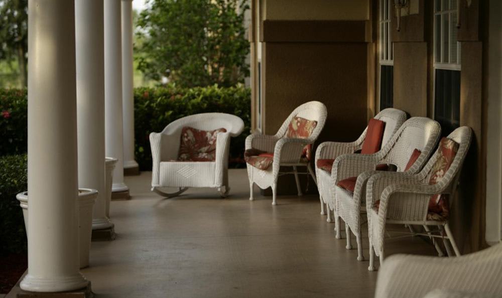 Relax outside at our senior living facility in Naples