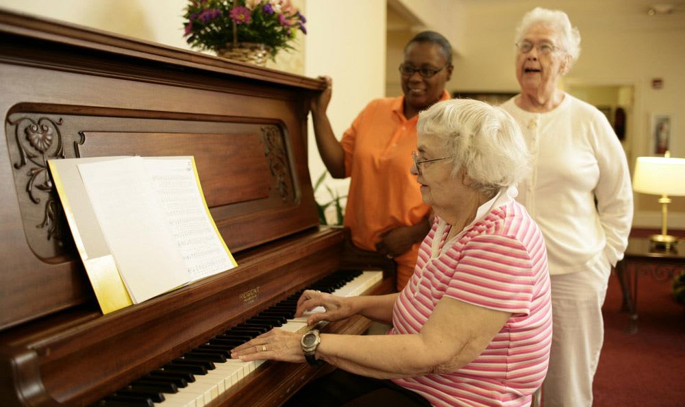 Sing with our wonderful staff at our senior living facility in Rock Hill