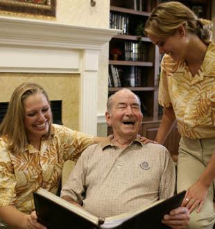 Happy senior living residents enjoy a good book in Vero Beach