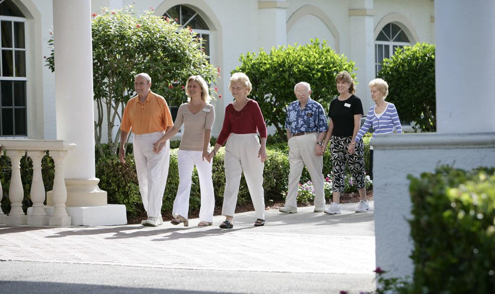 Take a beautiful walk around our senior living facility with our staff and friends in Naples