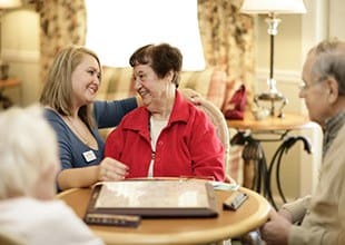 Resident friends share a laugh at HarborChase