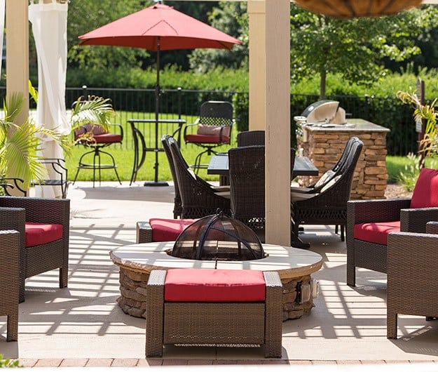 View of the firepit and outdoor barbecue area here at The Seasons at Umstead luxury apartments