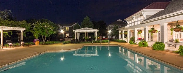 Enchanting evening view of the pool and clubhouse area at The Seasons at Umstead