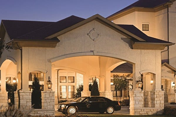 Our car and driver await out front to drive you to an evening event in Keller.