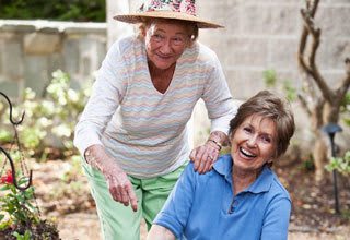 Senior living residents garden together for social health