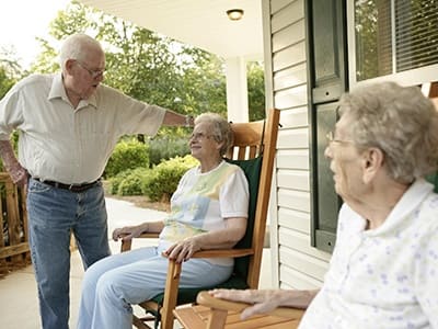 HRA senior resident relax on the porch