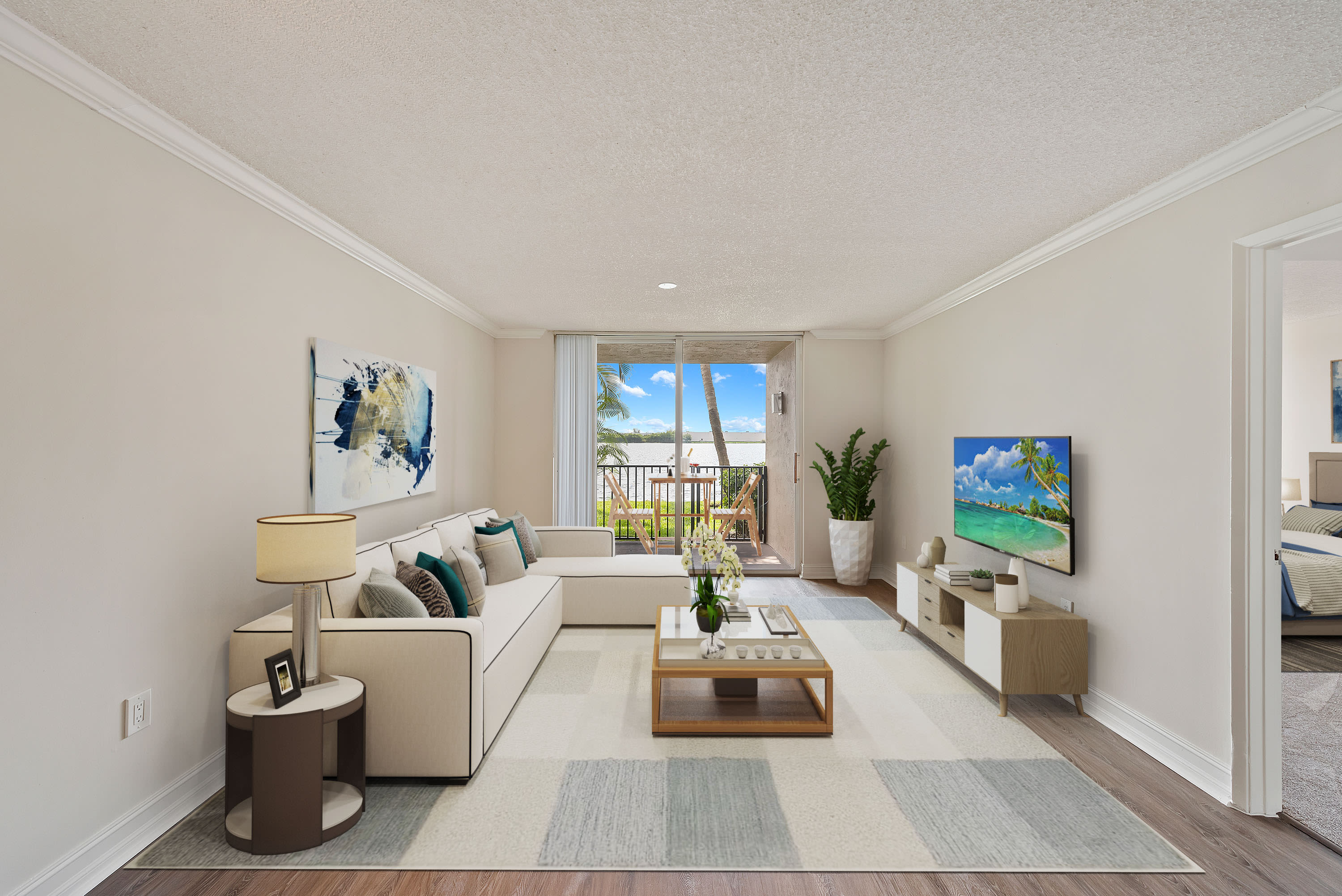 Living room with private balcony at St. Tropez Apartments in Miami Lakes, Florida
