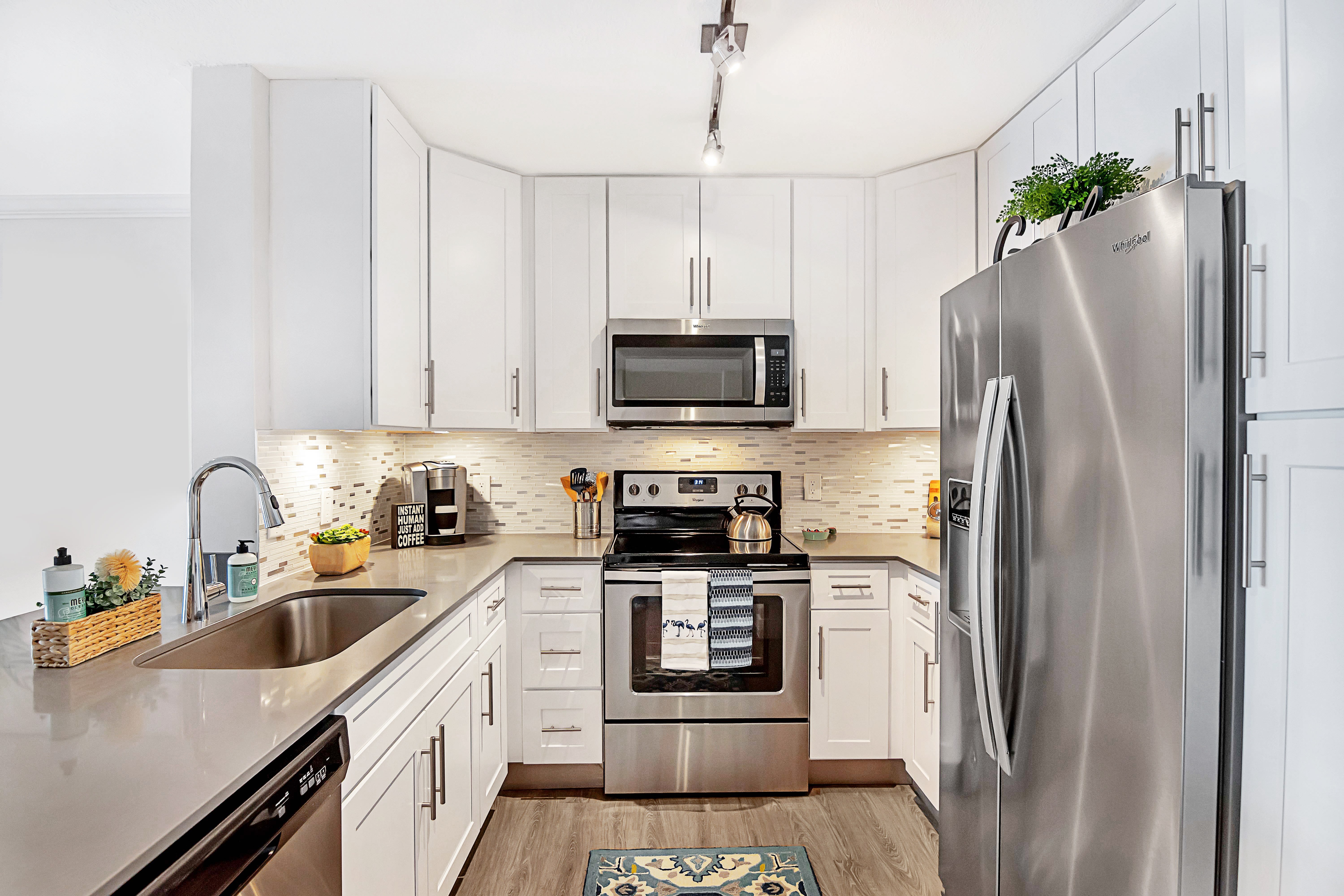 Model kitchen with great counter space at St. Tropez Apartments in Miami Lakes, Florida