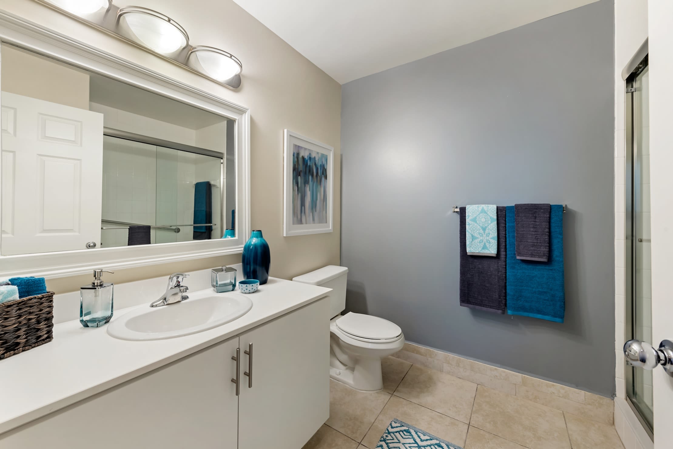 Spacious bathroom with expansive counter space at Fountain House Apartments in Miami Lakes, Florida