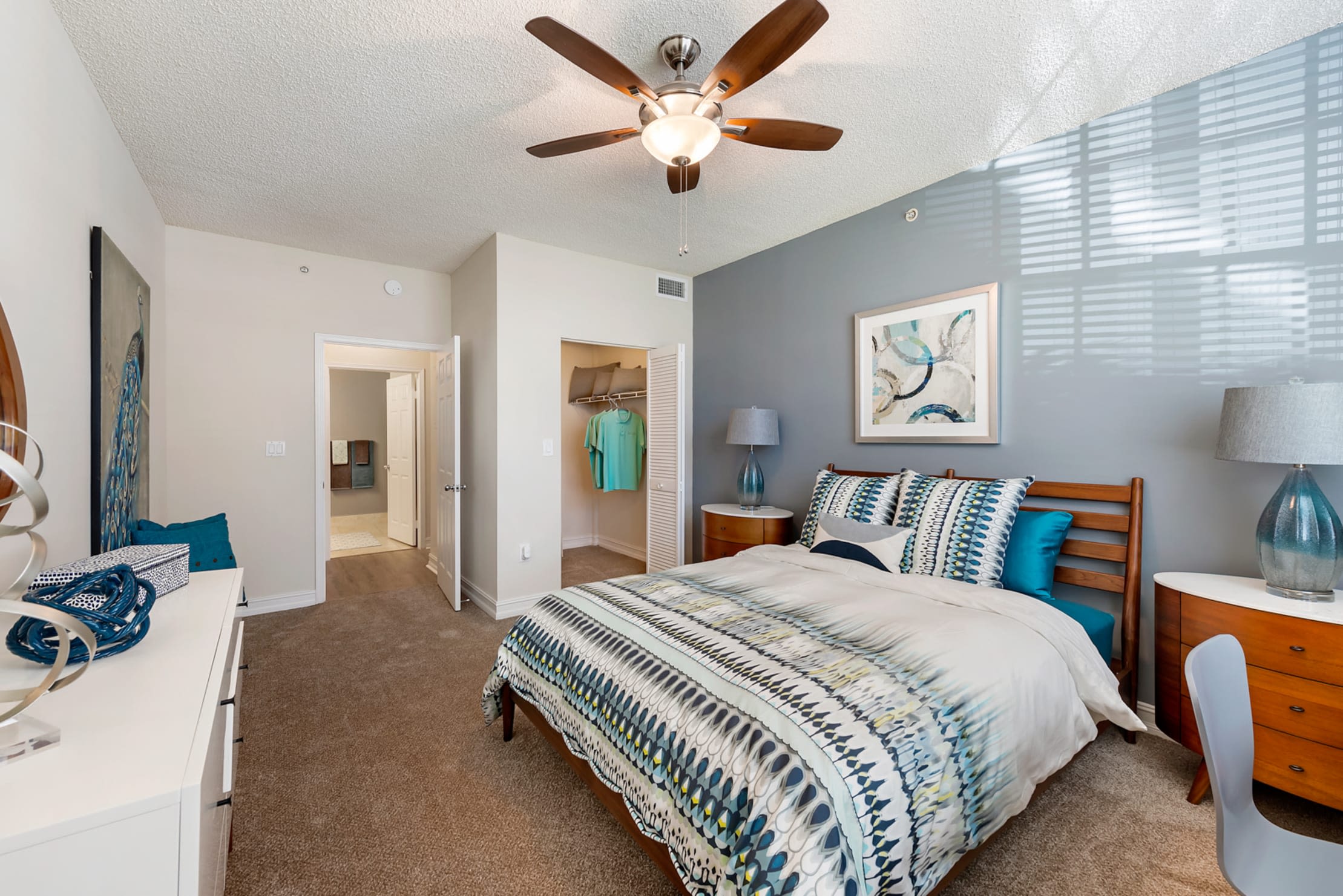 Large bedroom with attached walk in closet at Fountain House Apartments in Miami Lakes, Florida