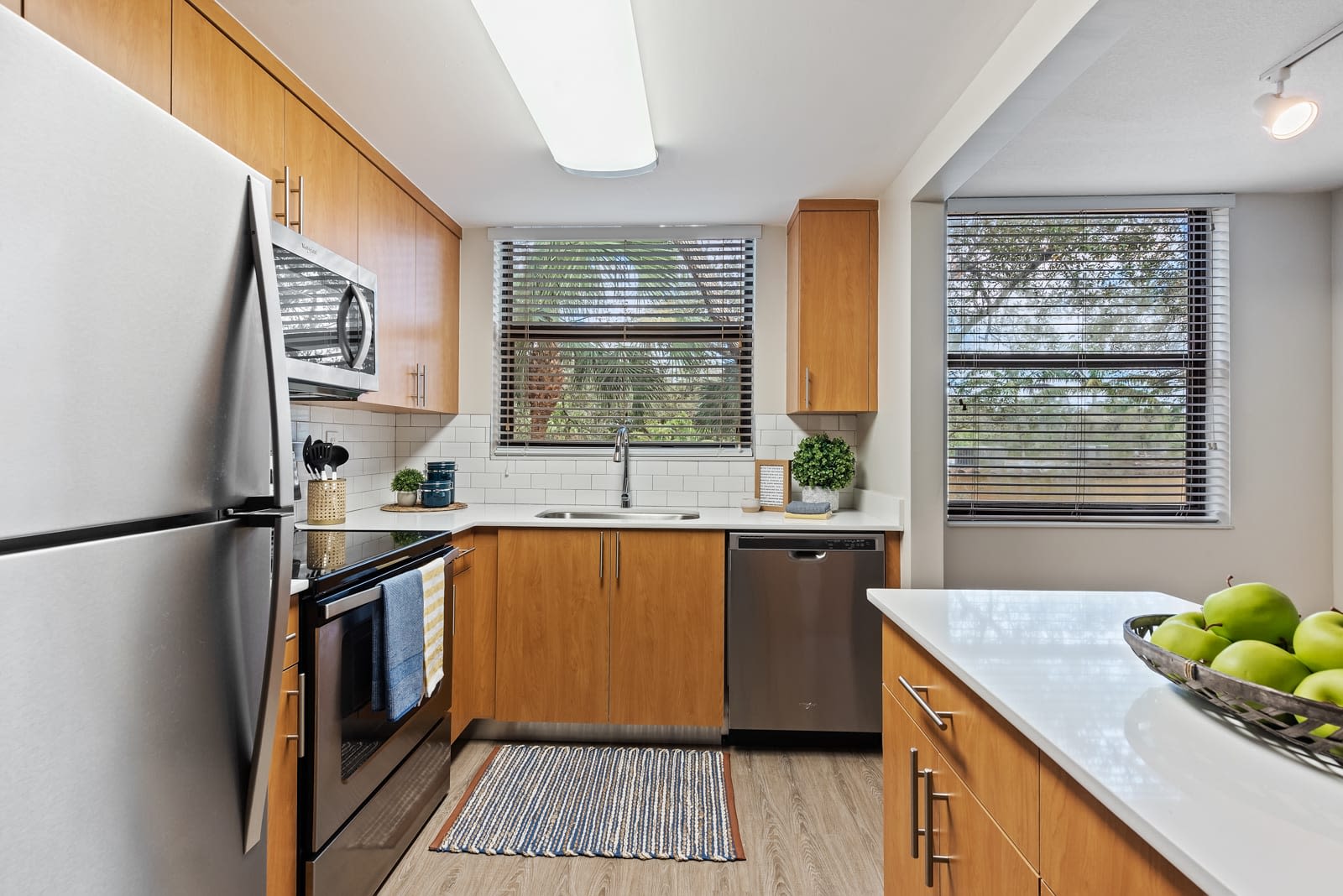 Fully equipped kitchen with stainless steel appliances at Bull Run Apartments in Miami Lakes, Florida