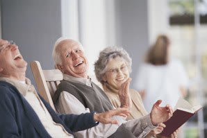 Happy friends relaxing on the porch at senior living in Ocala