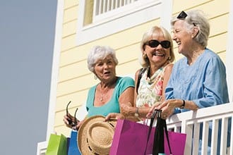 Three ladies on balcony at Discovery Village At Melbourne