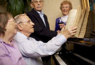 Senior living residents playing music