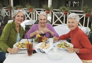 Senior living residents in Florida visiting over lunch