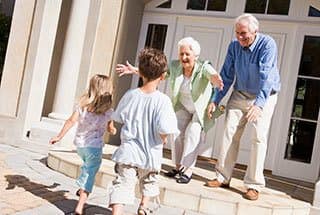 Senior living residents in Naples visiting with their grandchildren