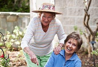 Senior living residents gardening outdoors in Bradenton