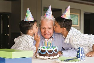 A senior living resident in Bradenton celebrates his birthday with relatives