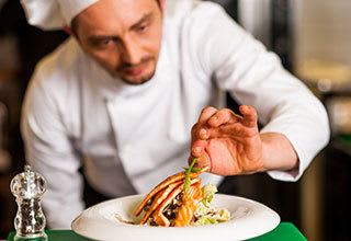 Professional chefs prepare gourmet food for residents at our Palm Beach Gardens senior living community