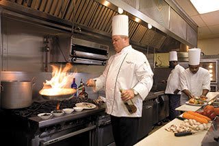 Professional chef preparing a meal at our Palm Beach Gardens senior living community