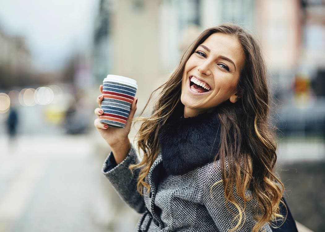 Woman drinking coffee in Huntersville near Brookson Resident Flats