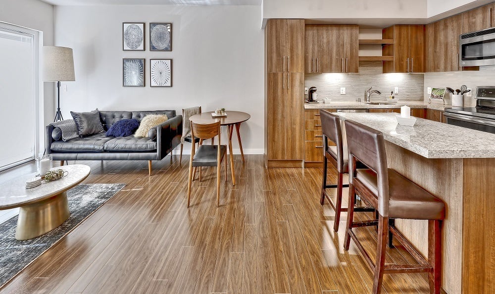 Open floor plan with wood style flooring at The Meyden in Bellevue, Washington