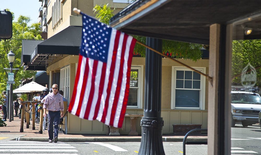 America flag hanging outside of a local business near The Meyden in Bellevue, Washington