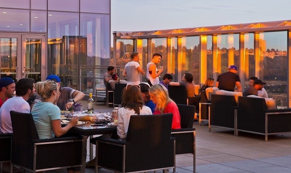 Residents chatting on the roof at The Wave at Stadium Place in Seattle, Washington
