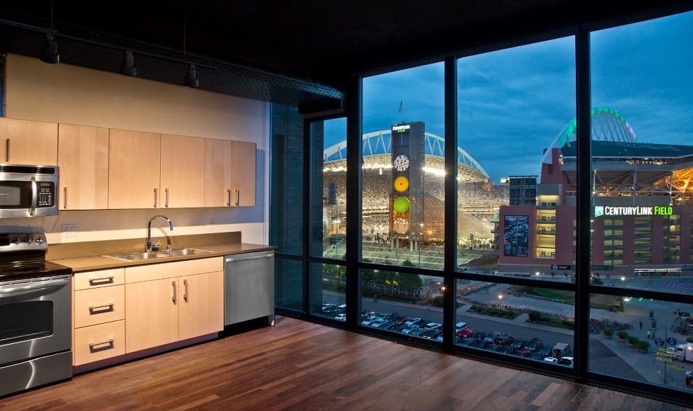 Living room with a stunning view at The Nolo at Stadium Place in Seattle, Washington