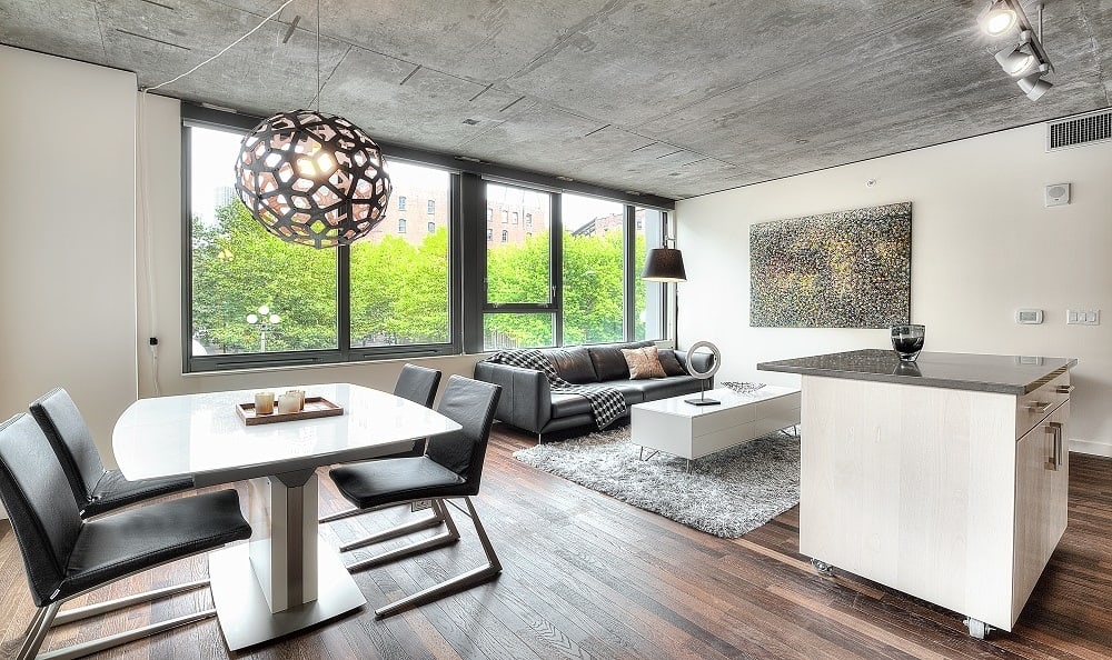 Living room with wood style flooring at The Nolo at Stadium Place in Seattle, Washington