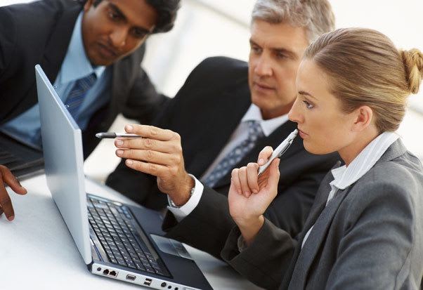Photo of our team at work here at JVM Realty Corporation
