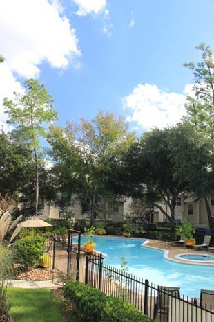 Pool and surrounding courtyard apartments in Spring