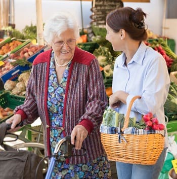 Shopping at the grocery store resident and caretaker