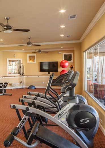 Fitness center at Oak Forest in Victoria, TX