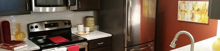 Interior features at Sunrise Briar Forest such as a gourmet kitchen with stainless steel appliances and granite countertops