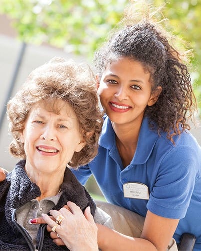 Resident and aid spending time together at The Wellington senior living community in Salt Lake City