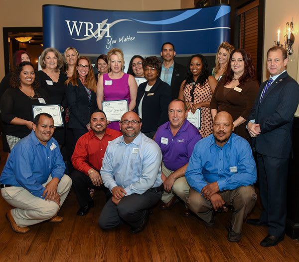 Happy employees at WRH Realty Services, Inc