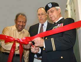 Veterans Cutting the Ribbon to the New Community Room at American House