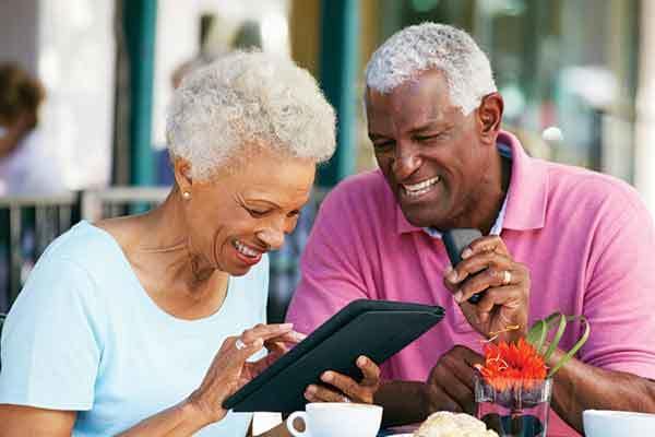 The Trace residents with a tablet