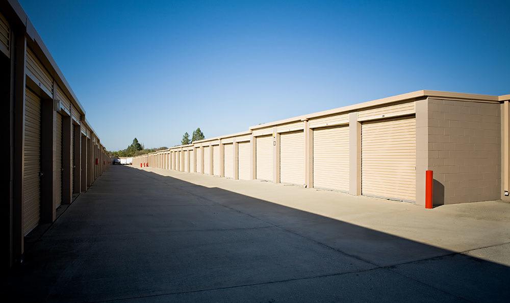 A row of outdoor storage units at Placer Self Storage in Rocklin, California