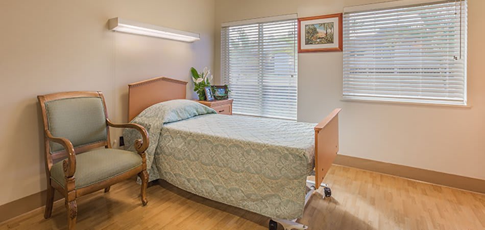 Resident room with height-adjustable bed at Kauai Care Center in Waimea, Hawaii
