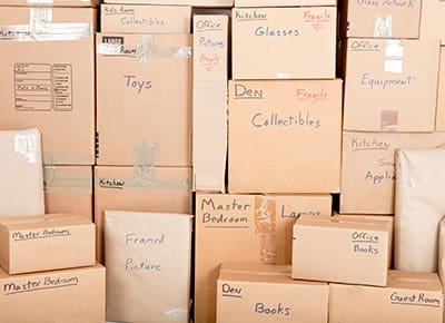 Boxes are sealed, labeled, and ready to be moved into their secure storage unit at A Storage Place