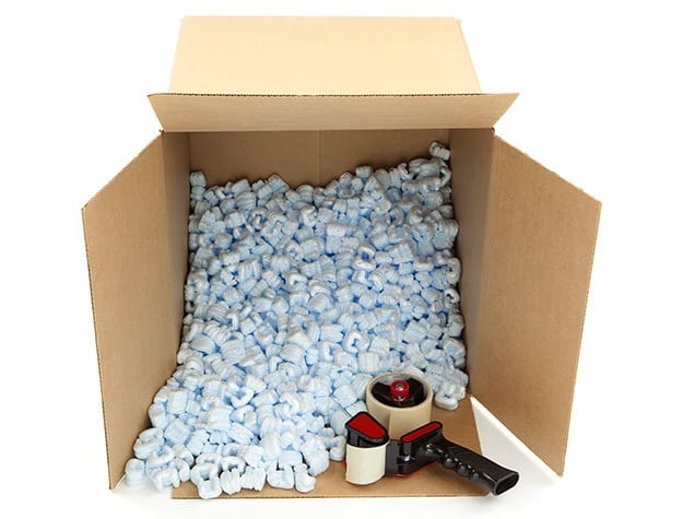 Image of a box about ready to be taped shut and moved to its new home at A Storage Place