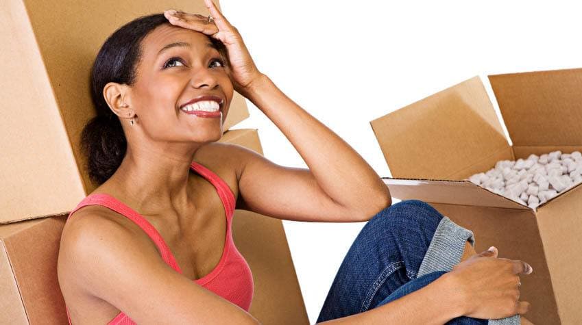 Woman packing moving boxes at American Mini Storage