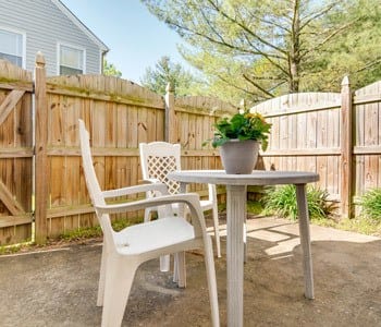 Outside Fenced In Table And Chairs