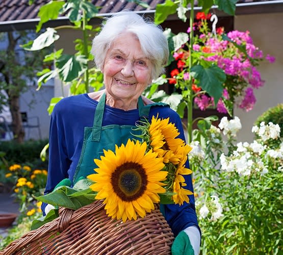 One of our residents here at Grand Villa of Lakeland tending to her garden at our community in Florida
