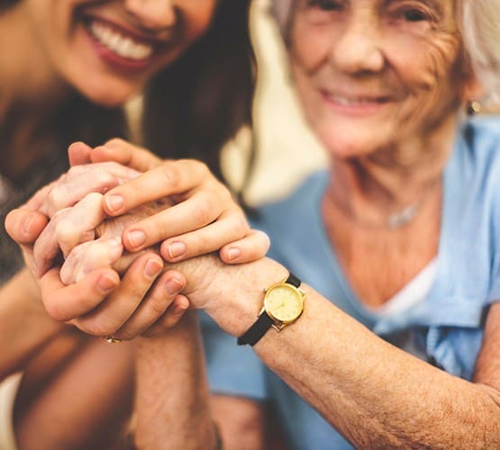 Mother and daughter enjoying a moment at our wonderful senior living community at Grand Villa of Ormond Beach in Ormond Beach, Florida