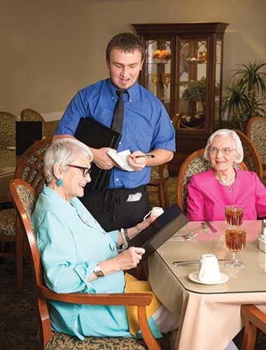 Seniors ordering a lovely meal at Green Oaks Senior Living